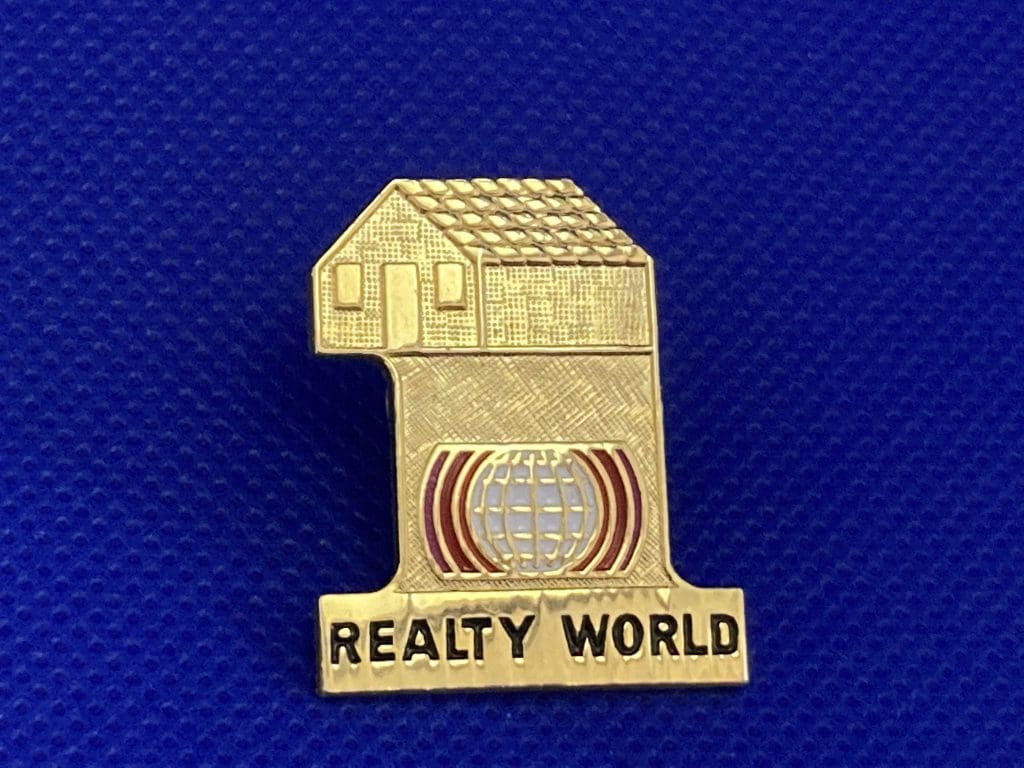 Realty World lapel pin