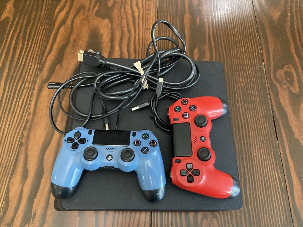 PS4 Slim system with 2 controllers - red, blue