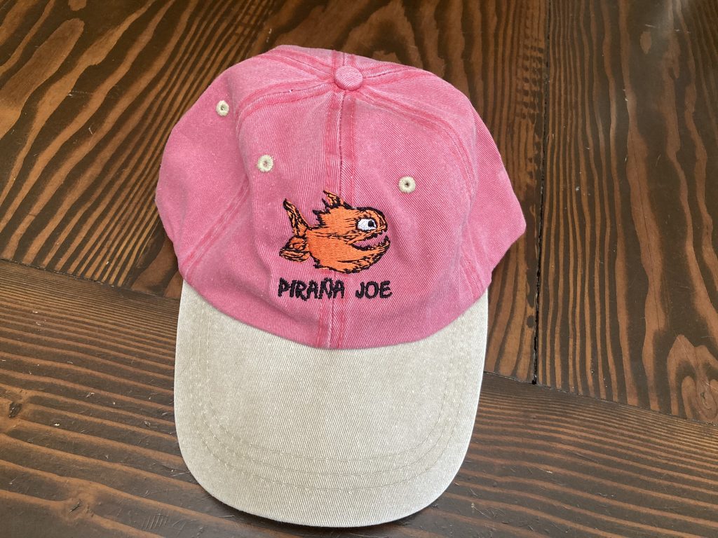 faded red Pirana Joe Jamaica hat