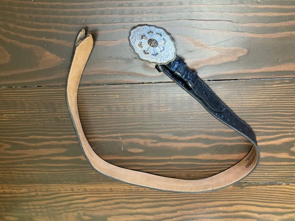 Black Nocona belt with decorative buckle